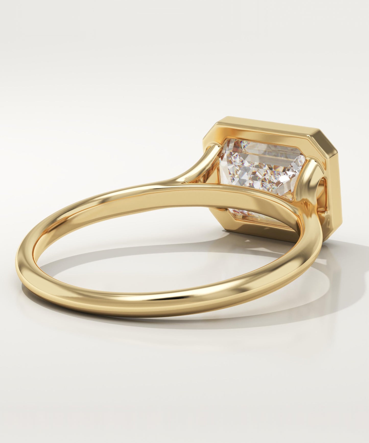 East West Emerald Cut Bezel Lab-Grown Diamond Engagement Ring