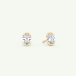 1 TCW Oval Cut Moissanite Half Bezel Stud Earrings in Gold