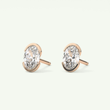 1 TCW Oval Cut Moissanite Half Bezel Stud Earrings in Gold