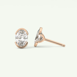 1 TCW Oval Cut Moissanite Half Bezel Stud Earrings in Gold
