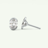 1 TCW Oval Cut Moissanite Half Bezel Stud Earrings in Gold