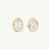 1 TCW Oval Cut Moissanite Bezel Stud Earrings in Gold