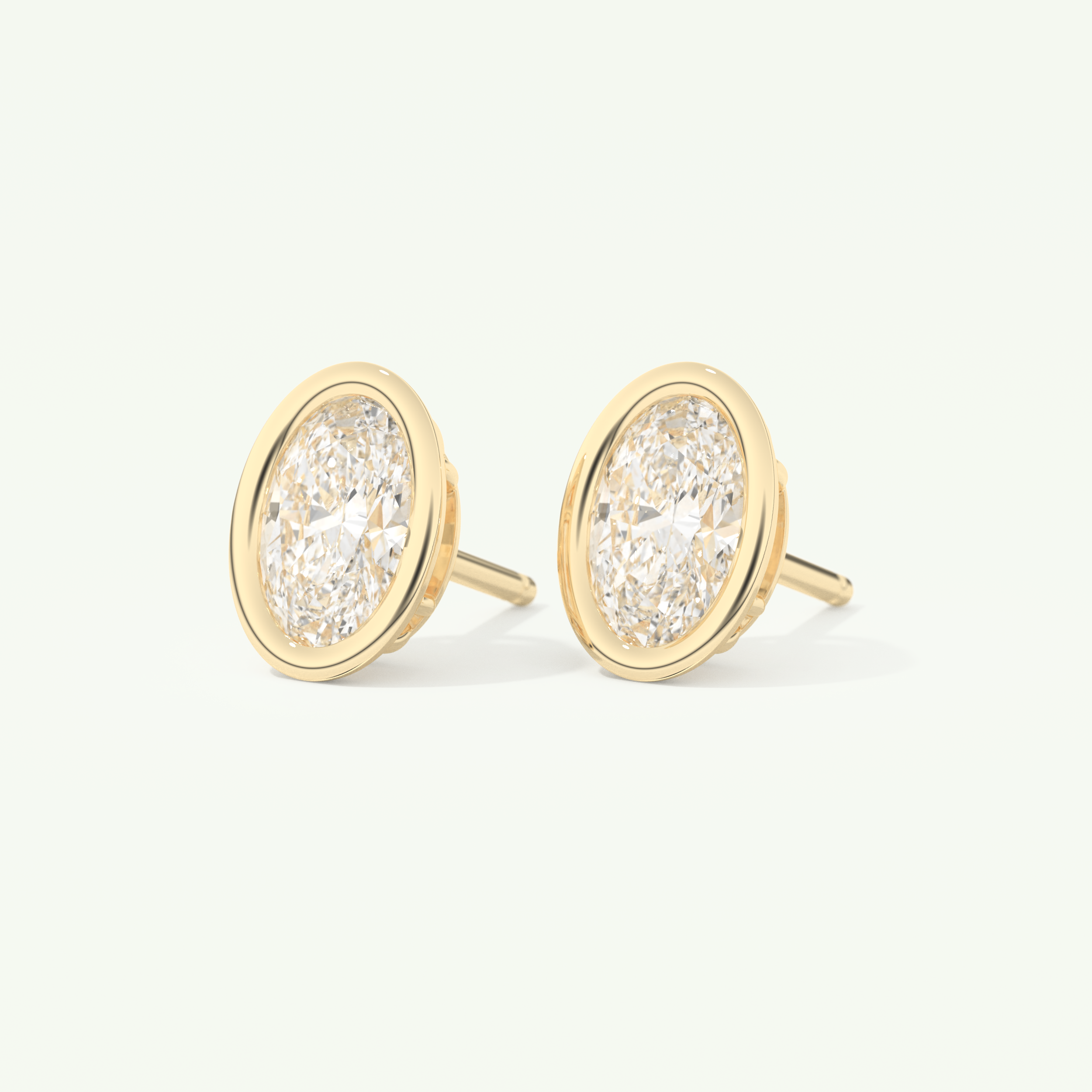 1 TCW Oval Cut Moissanite Bezel Stud Earrings in Gold