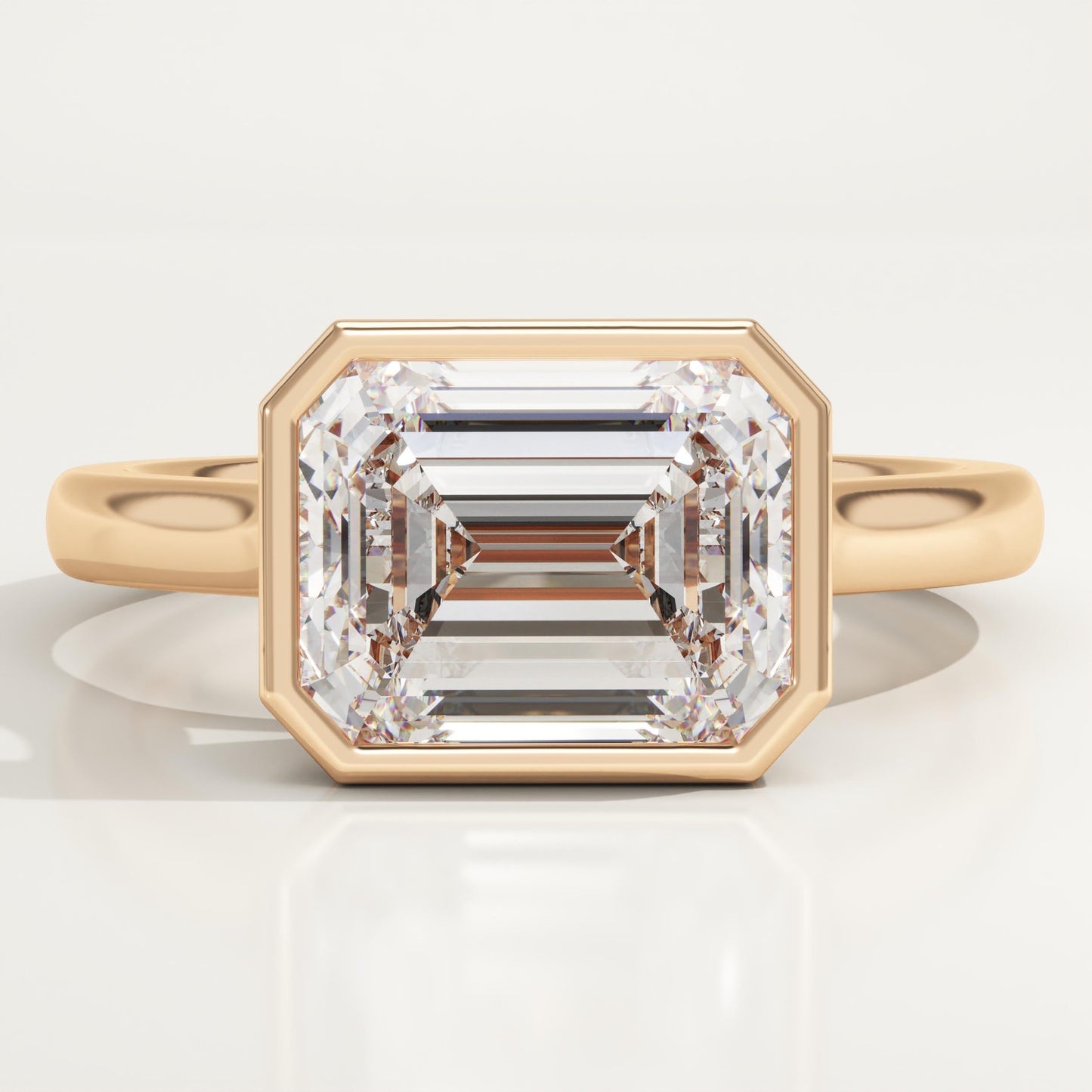 East West Emerald Cut Bezel Lab-Grown Diamond Engagement Ring