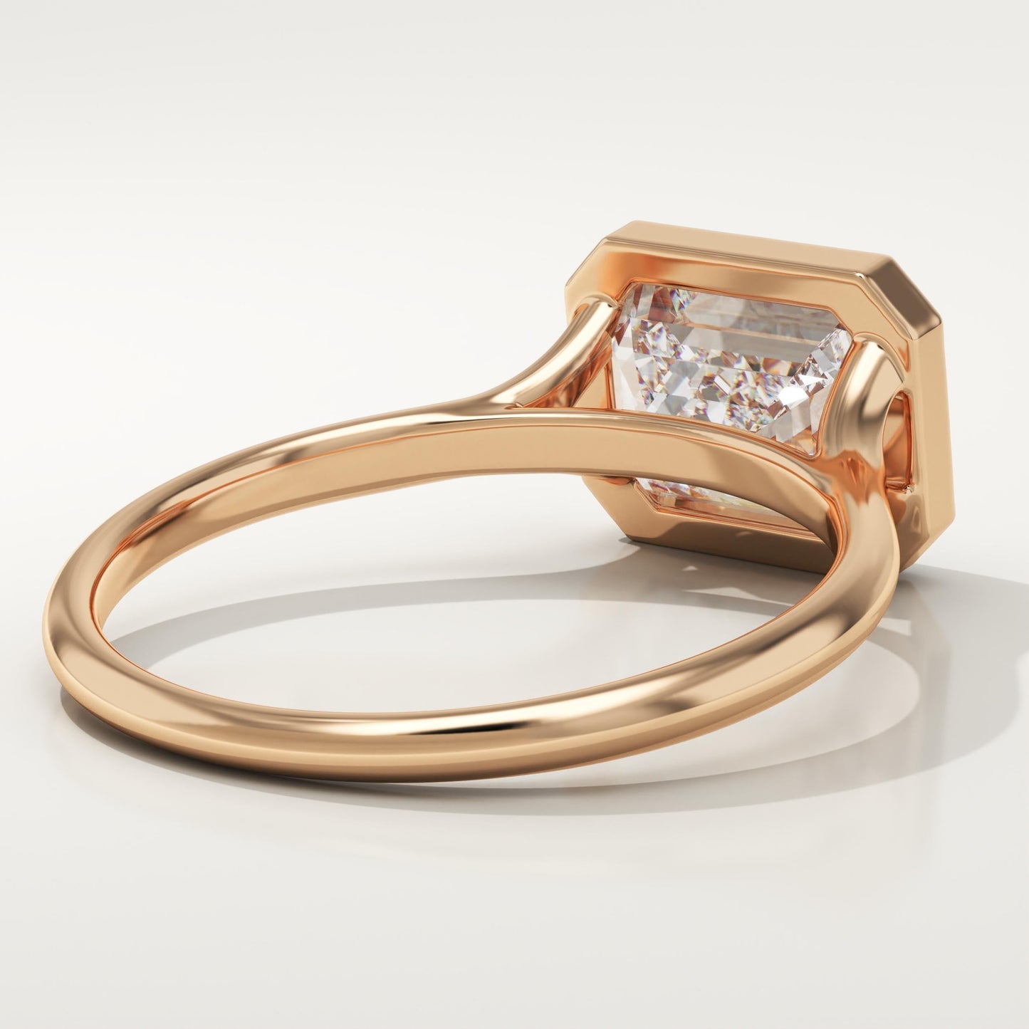 East West Emerald Cut Bezel Lab-Grown Diamond Engagement Ring