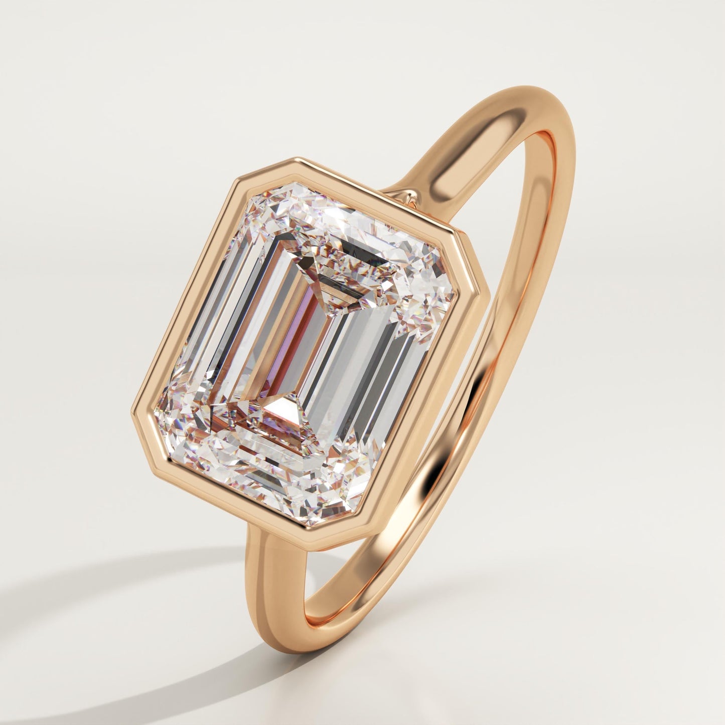 East West Emerald Cut Bezel Lab-Grown Diamond Engagement Ring