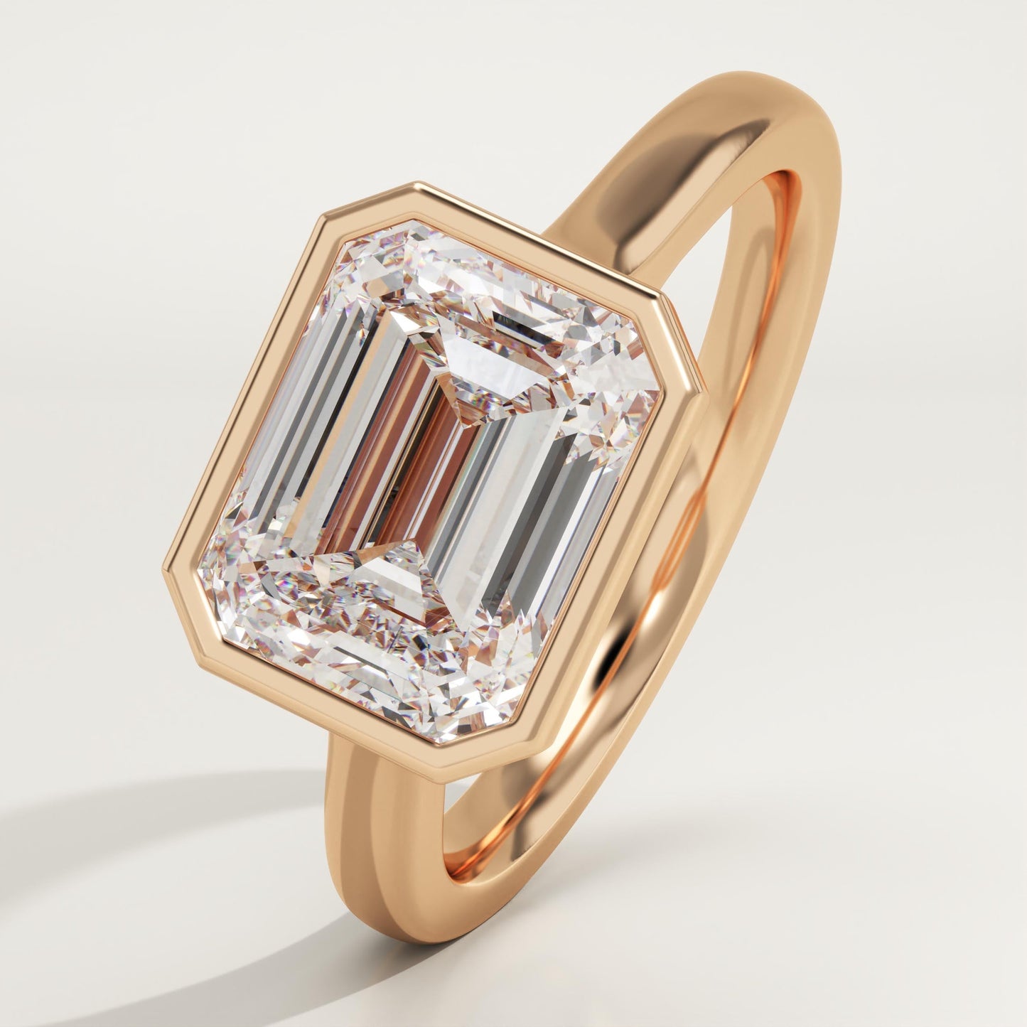 East West Emerald Cut Bezel Lab-Grown Diamond Engagement Ring