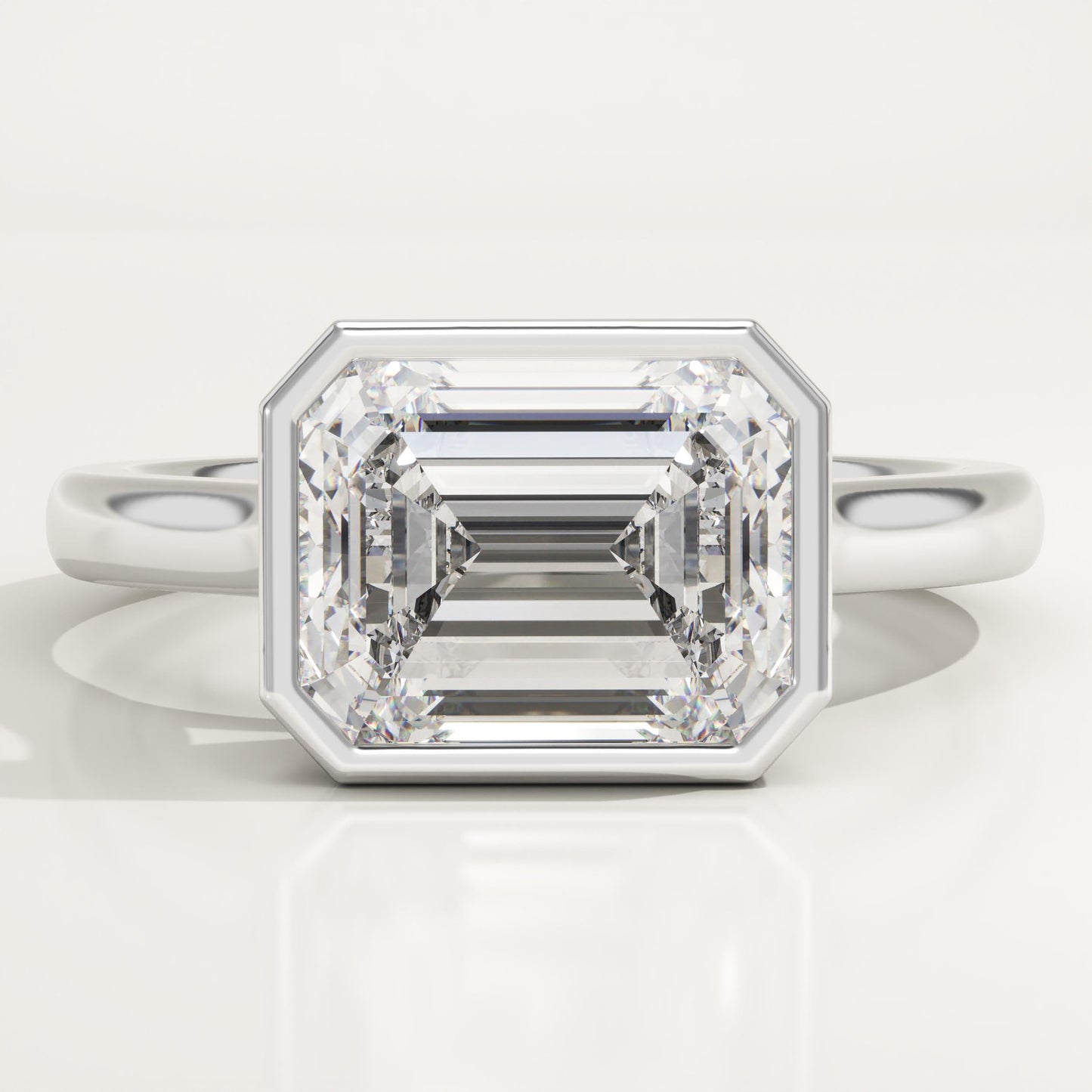 East West Emerald Cut Bezel Lab-Grown Diamond Engagement Ring