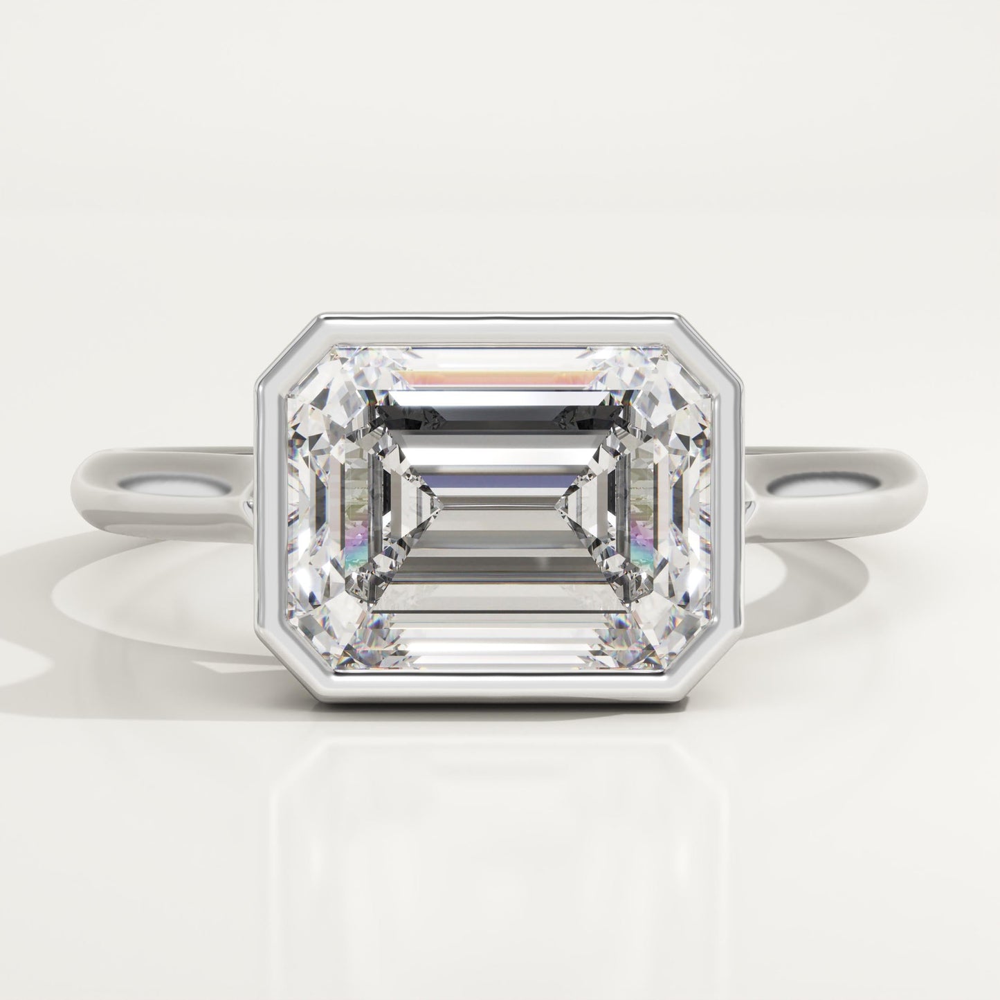 East West Emerald Cut Bezel Lab-Grown Diamond Engagement Ring