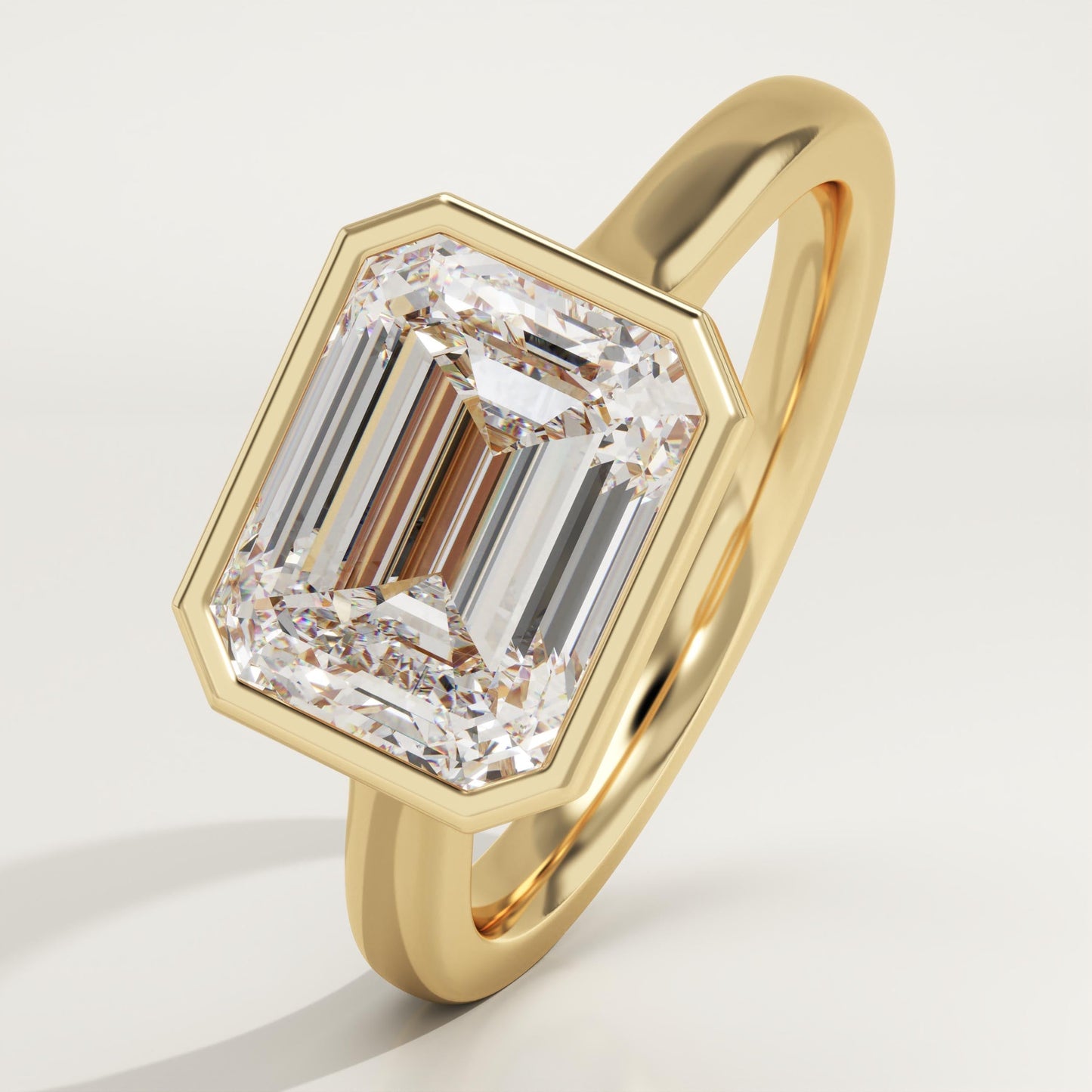 East West Emerald Cut Bezel Lab-Grown Diamond Engagement Ring