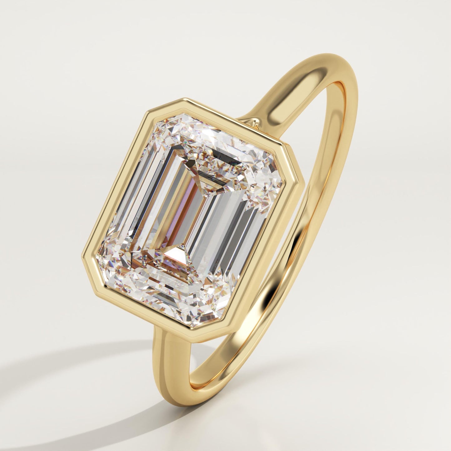 East West Emerald Cut Bezel Lab-Grown Diamond Engagement Ring